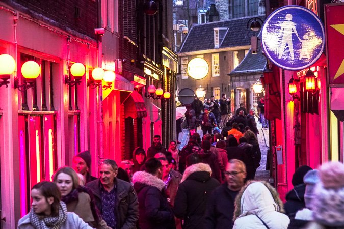 A glimpse at the famous crimson lights in the Amsterdam Red Light District