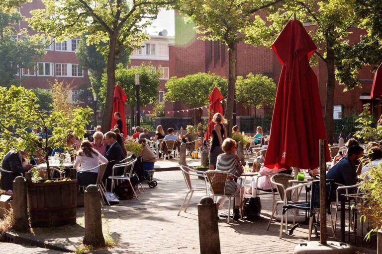 A cafe terrace on a summer afternoon in Amsterdam.